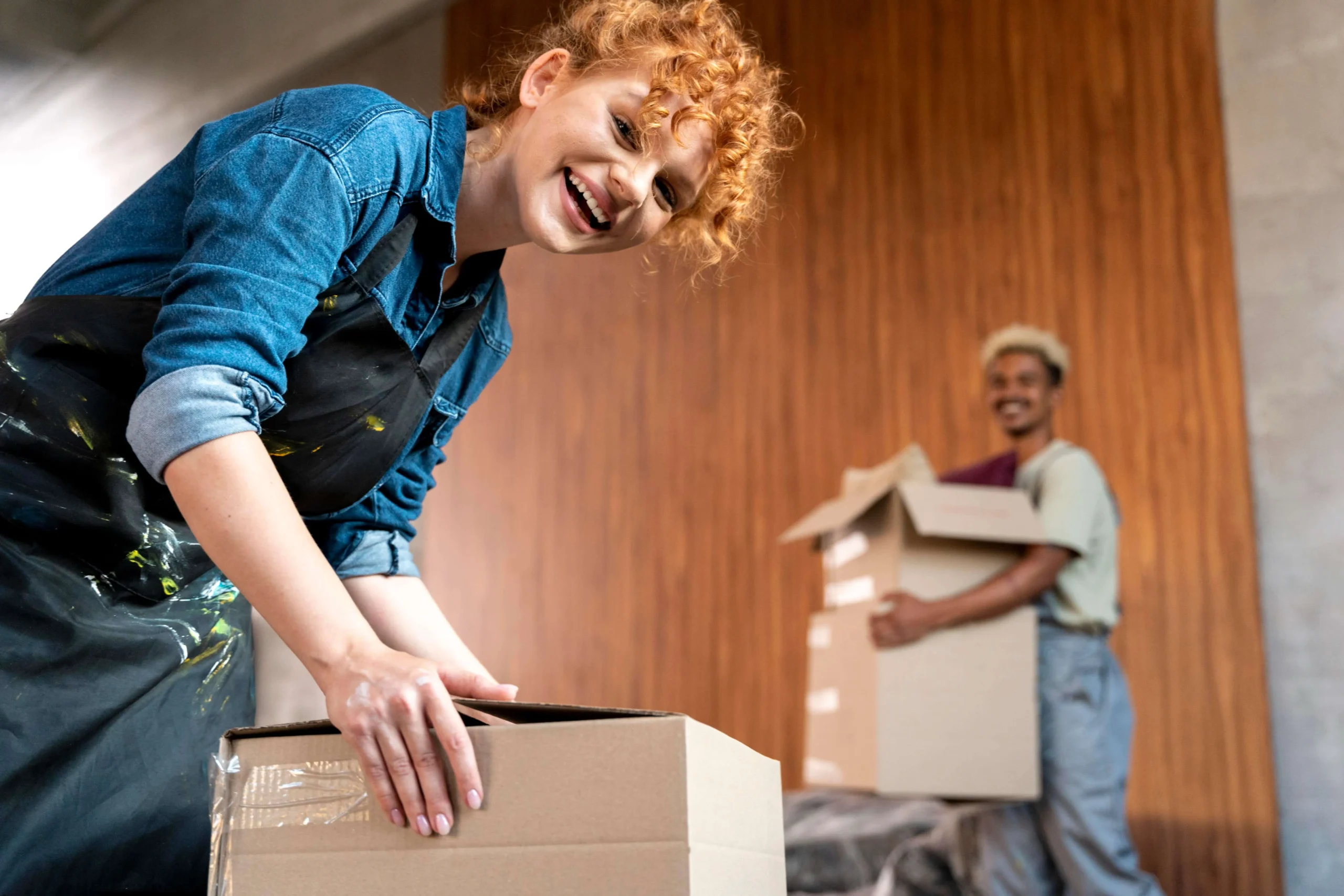 couple-with-cardboard-boxes-their-new-home (1)